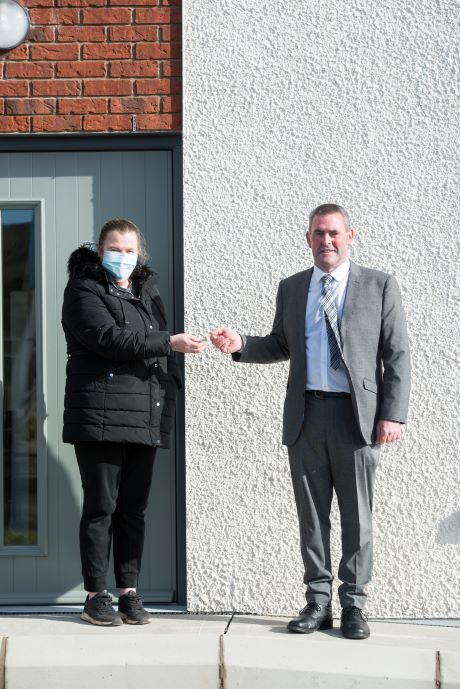 The Area Manager for Housing and Corporate Services, Mr Pauric Sheerin presenting Elaine, one of the new tenants in Phase 1 Oak Meadows, Drumbar, Donegal Town, with the keys of her new home.